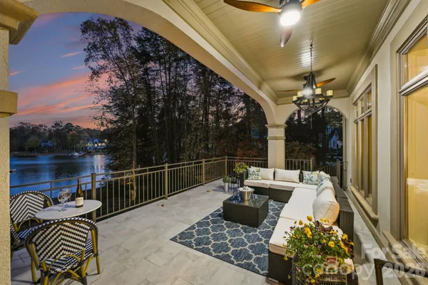 a living room with furniture a flat screen tv and rug