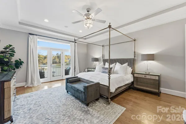 a bedroom with a large bed and a large window