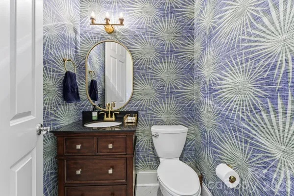 a view of a patio with couches table and chairs and potted plants