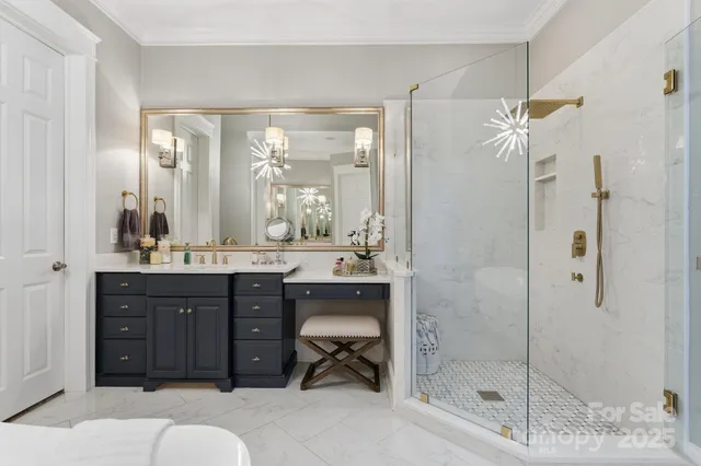 a bathroom with a granite countertop sink a mirror and a shower