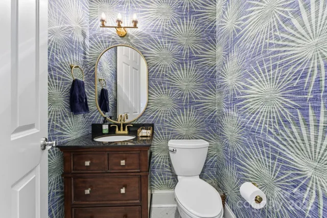 a spacious bedroom with a bed and a table in it