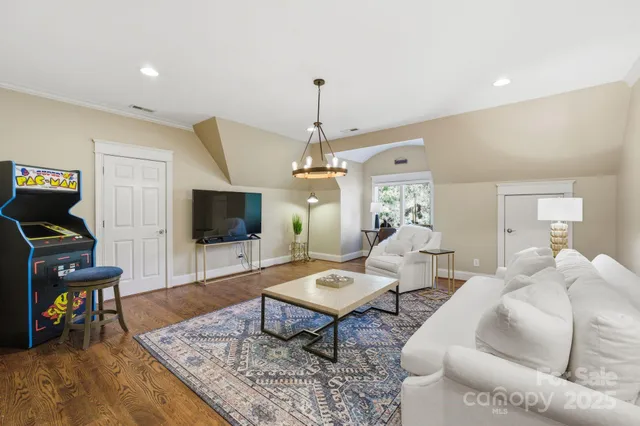 a bed room with a bed and a chair