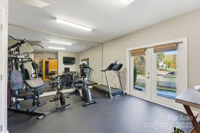 a view of hallway with livingroom and stairs