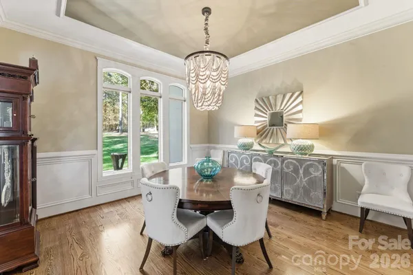 a large kitchen with a table and chairs