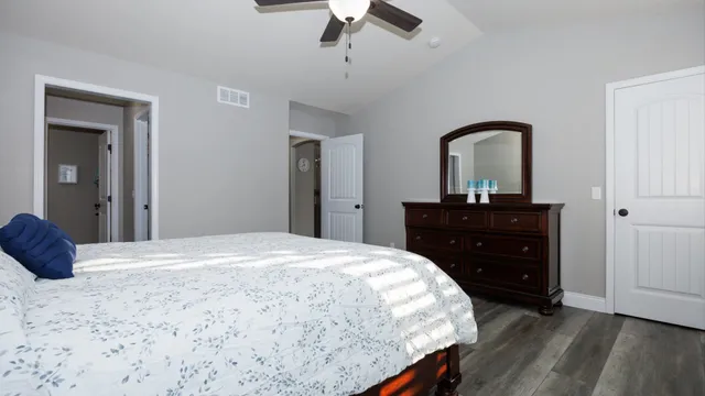 a bathroom with a granite countertop mirror and a sink