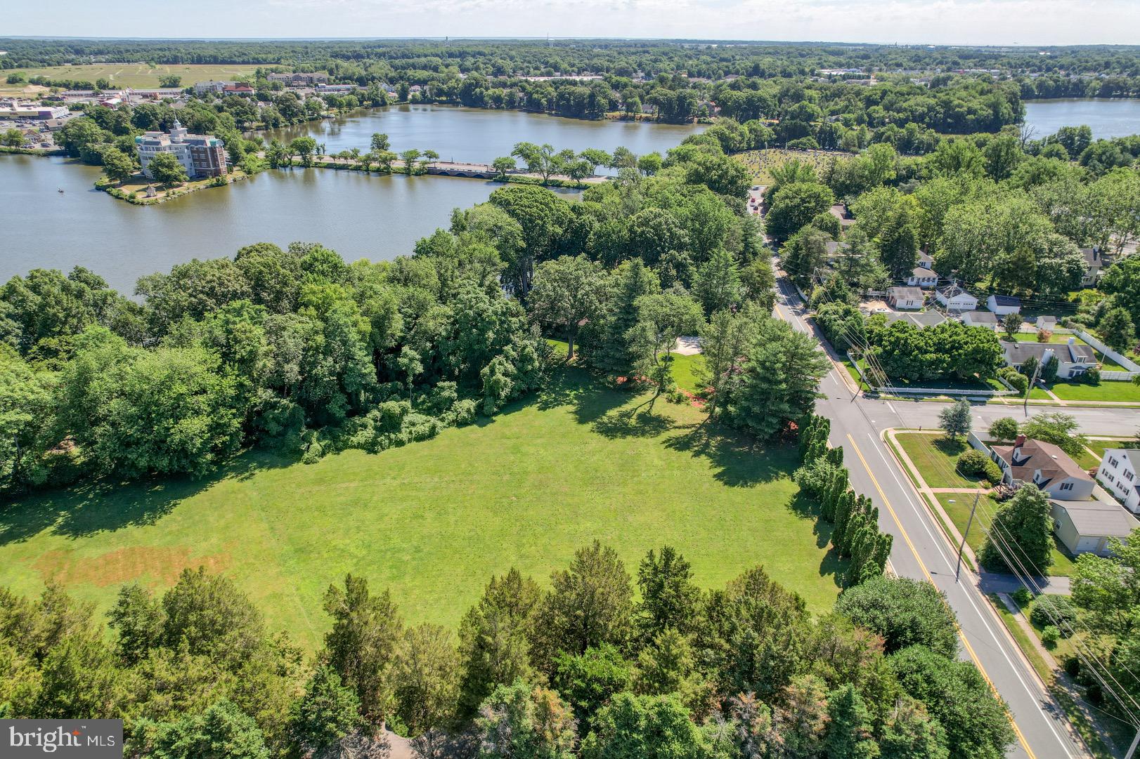 211 Walker Road Dover, DE 19904 - Photo 2 of 12 an aerial view of residential houses with outdoor space and lake view