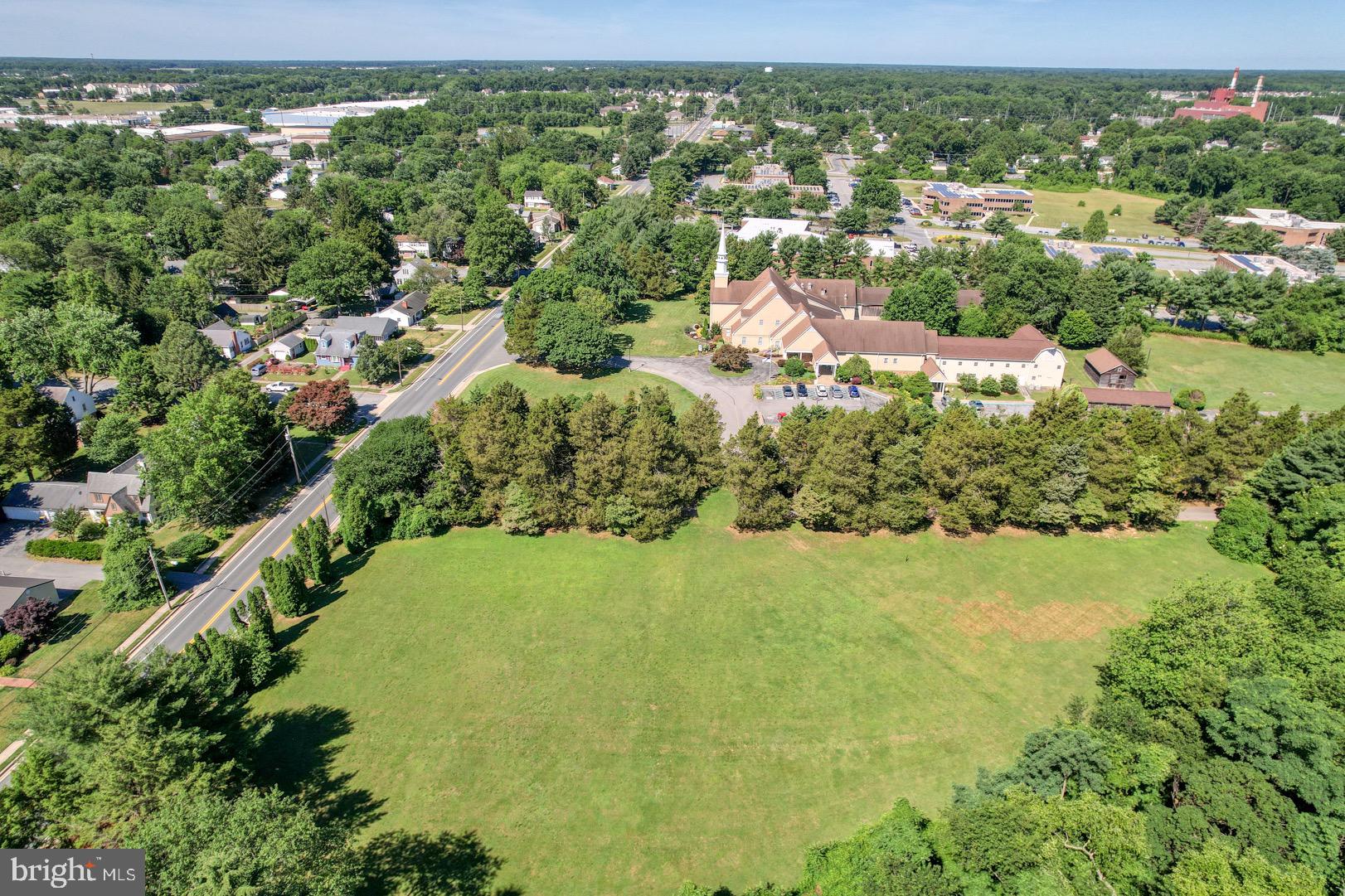 211 Walker Road Dover, DE 19904 - Photo 4 of 12 an aerial view of residential houses with outdoor space and trees