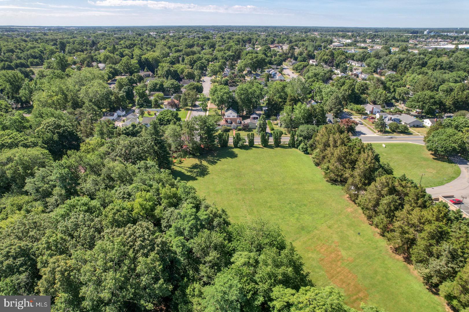 211 Walker Road Dover, DE 19904 - Photo 5 of 12 an aerial view of residential houses with outdoor space and trees