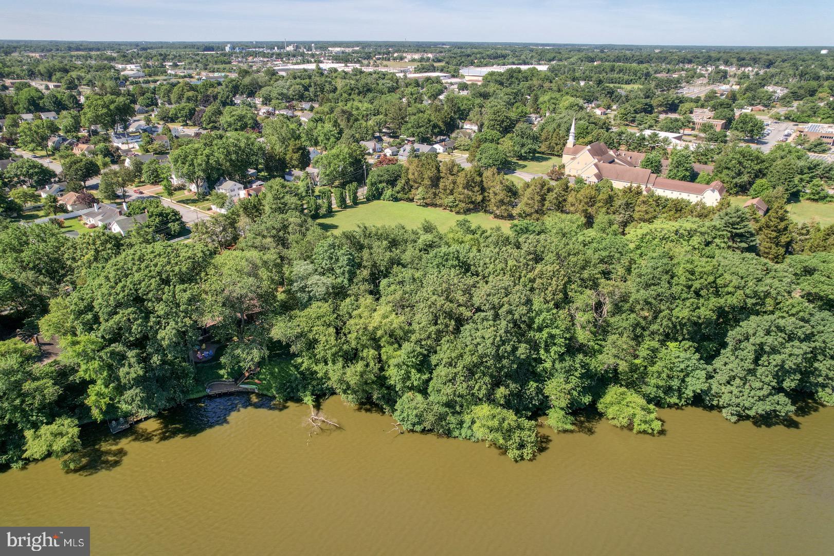 211 Walker Road Dover, DE 19904 - Photo 7 of 12 an aerial view of residential houses with outdoor space and trees
