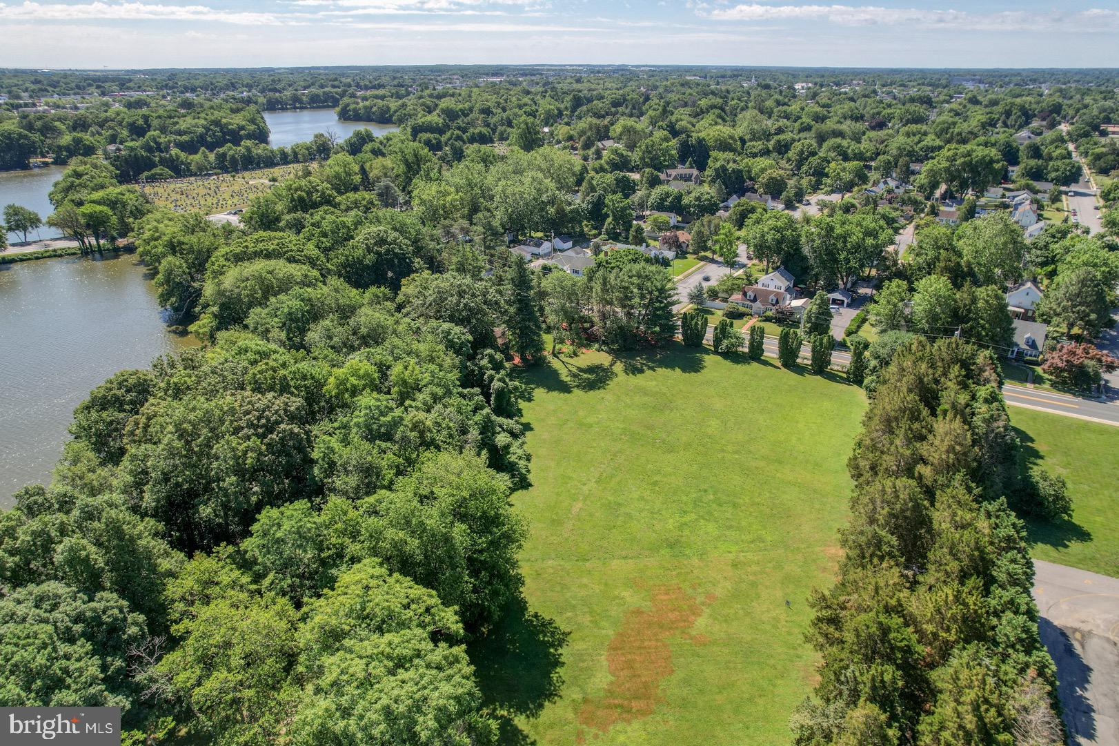 211 Walker Road Dover, DE 19904 - Photo 8 of 12 an aerial view of residential houses with outdoor space and trees