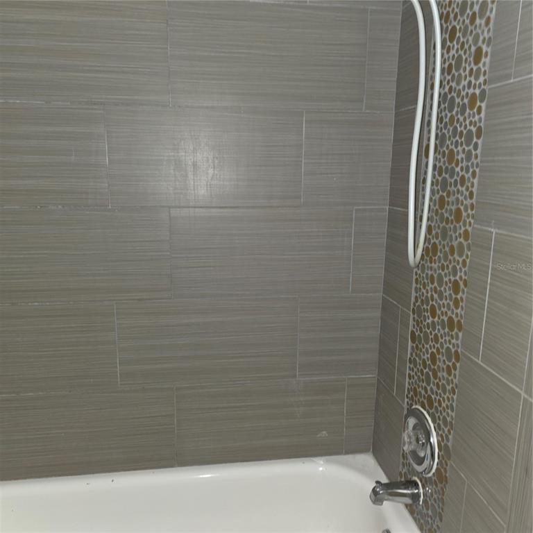 922 Lake Destiny Road, Unit F Altamonte Springs, FL 32714 - Photo 13 of 17 a bathroom with a shower