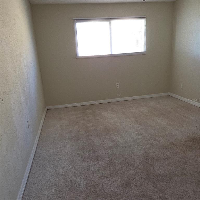 922 Lake Destiny Road, Unit F Altamonte Springs, FL 32714 - Photo 9 of 17 an empty room with a window