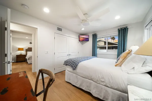 a bedroom with a bed and a view of bathroom