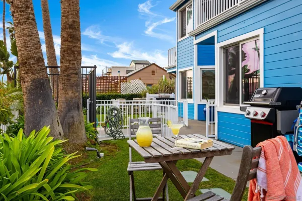 a view of a patio with table and chairs