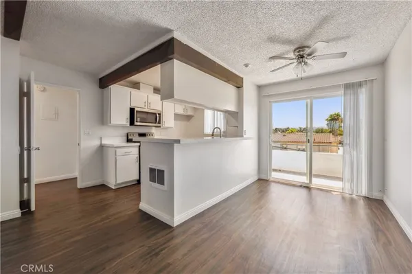 a kitchen with stainless steel appliances granite countertop a stove and a sink