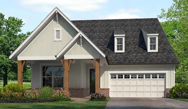 a front view of a house with a yard and outdoor seating