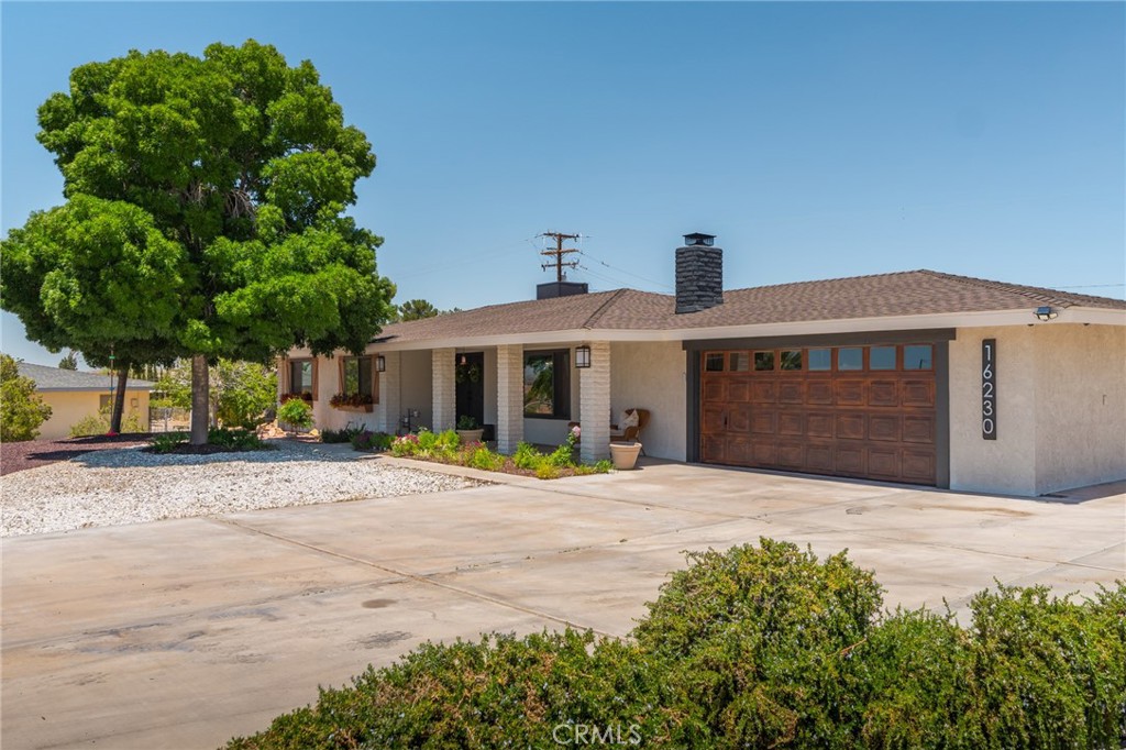16230 St Timothy Road Apple Valley, CA 92307 - Photo 3 of 51 Front of house from side