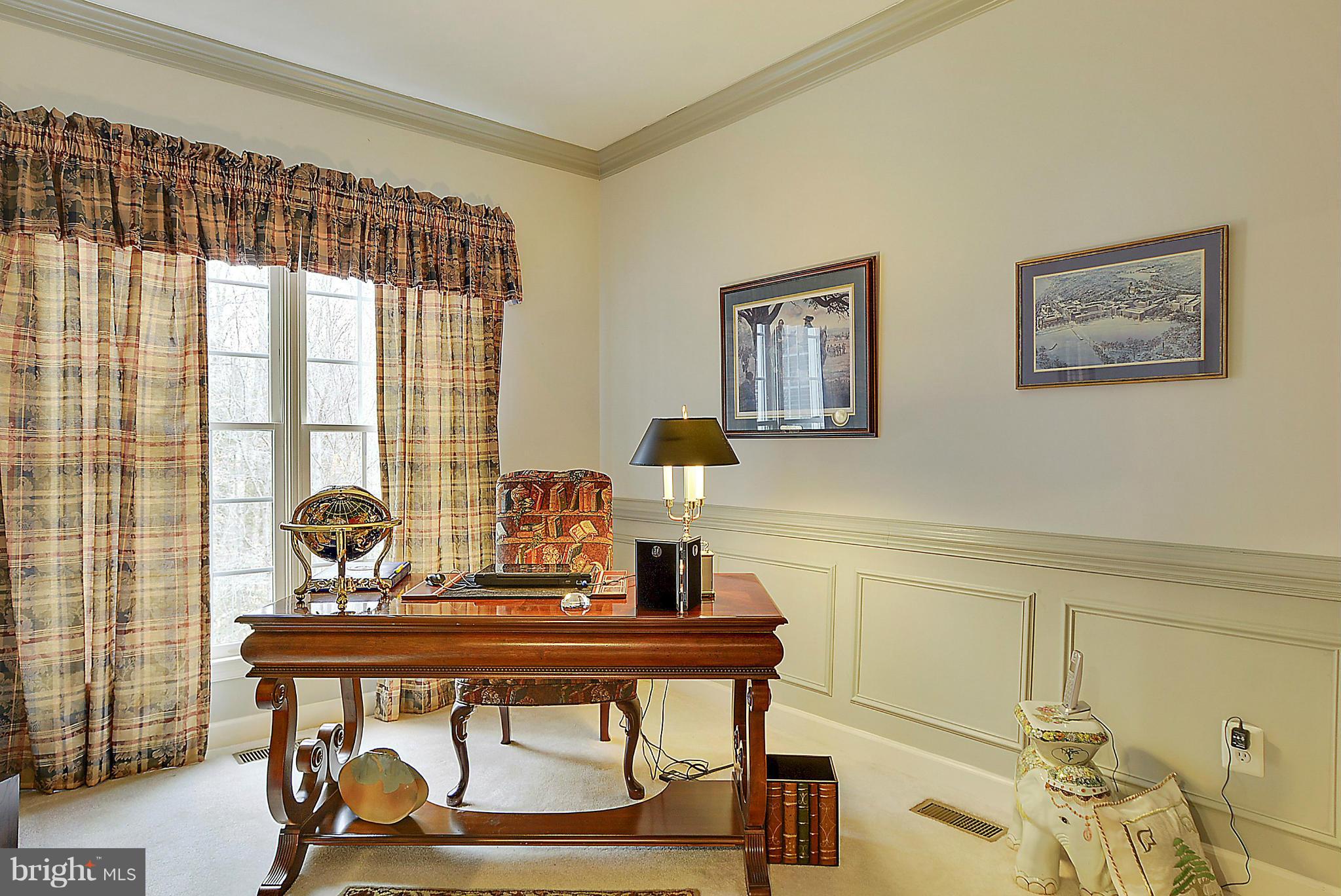 7406 Spring Summit Road Springfield, VA 22150 - Photo 13 of 30 a view of a workspace with furniture and a window