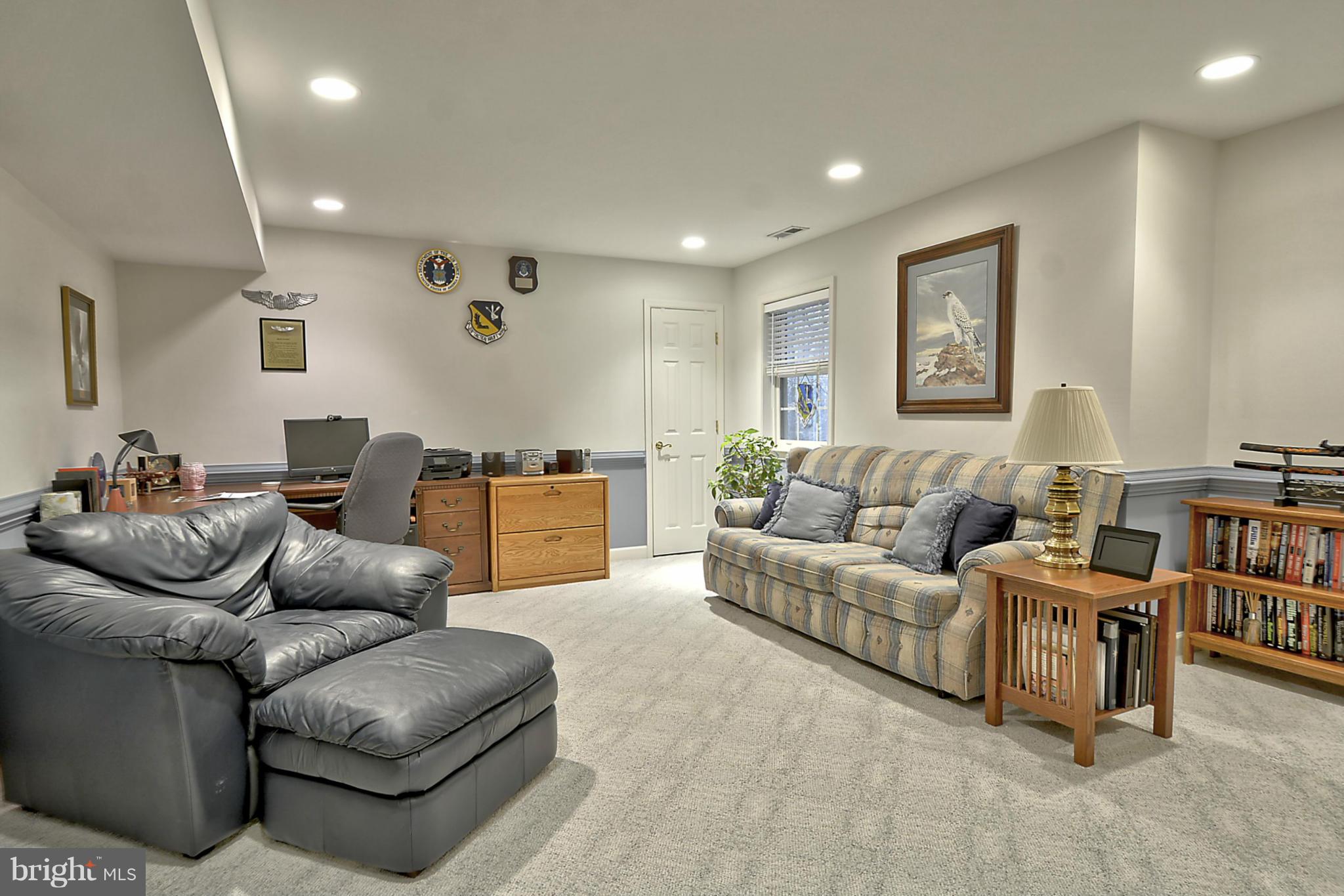 7406 Spring Summit Road Springfield, VA 22150 - Photo 23 of 30 a living room with furniture and a air conditioner vent