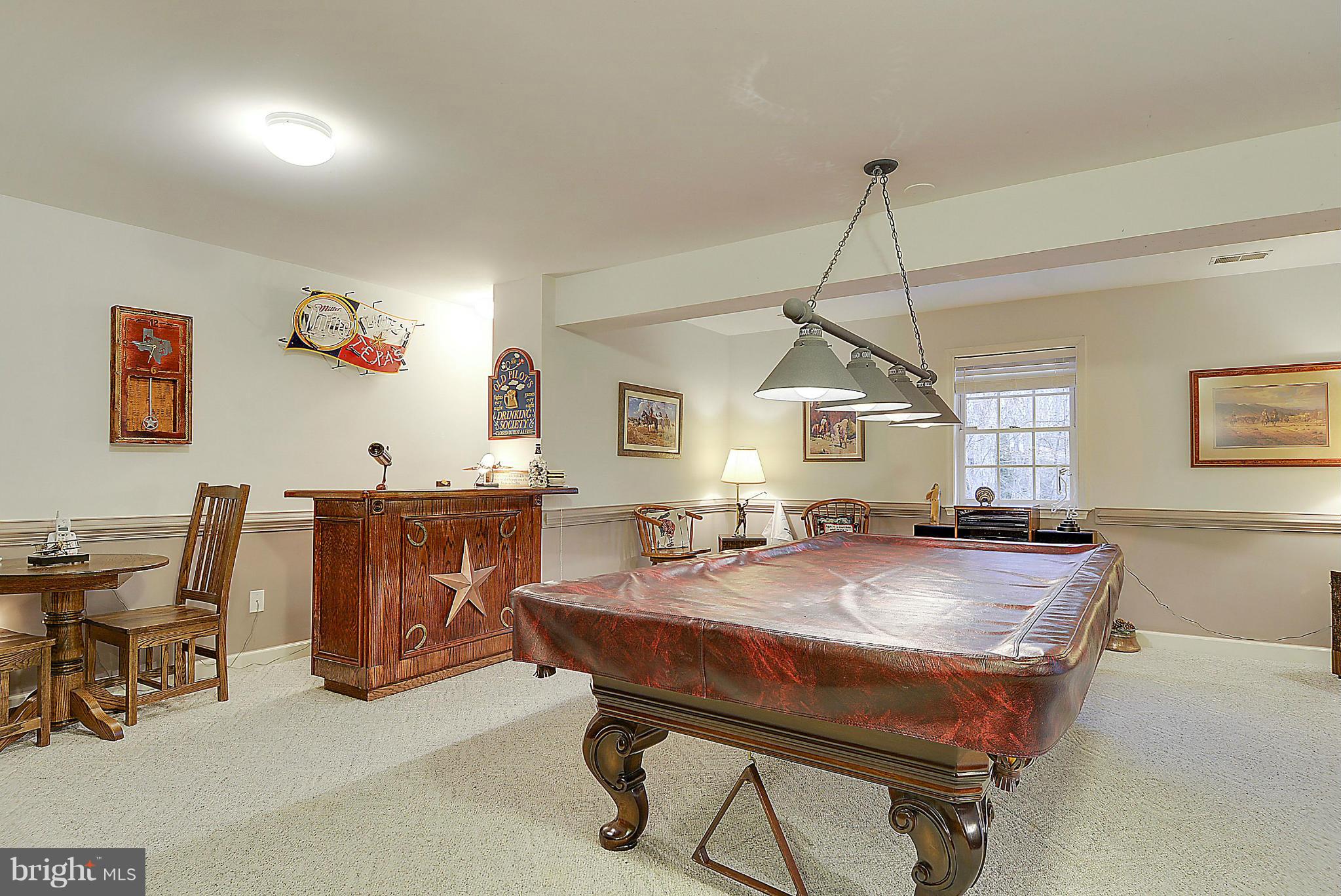 7406 Spring Summit Road Springfield, VA 22150 - Photo 24 of 30 a room with table chairs and dining table