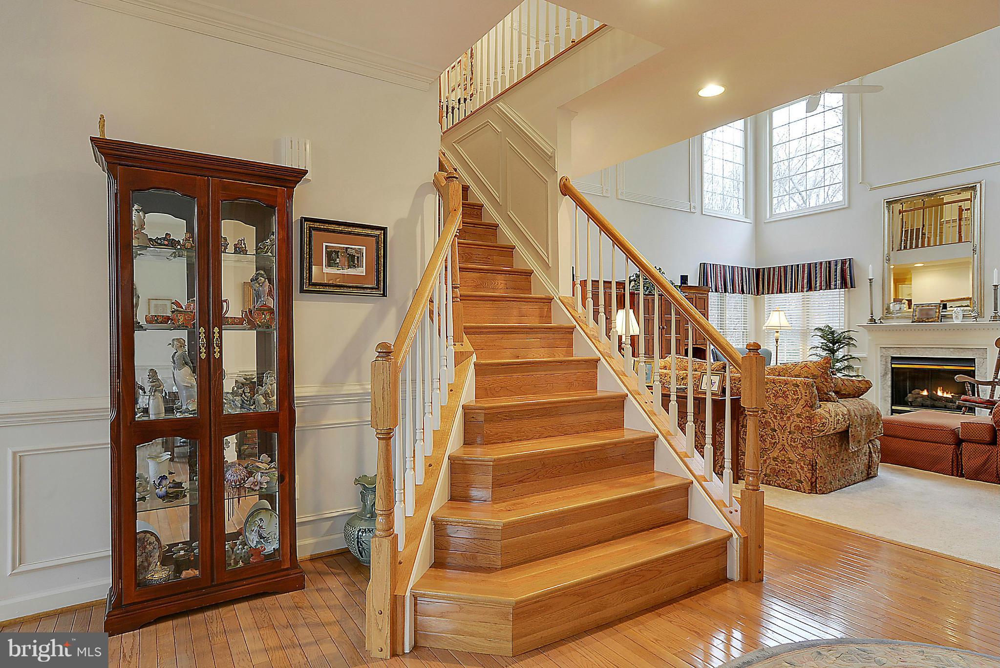 7406 Spring Summit Road Springfield, VA 22150 - Photo 5 of 30 a view of entryway and hall with wooden floor