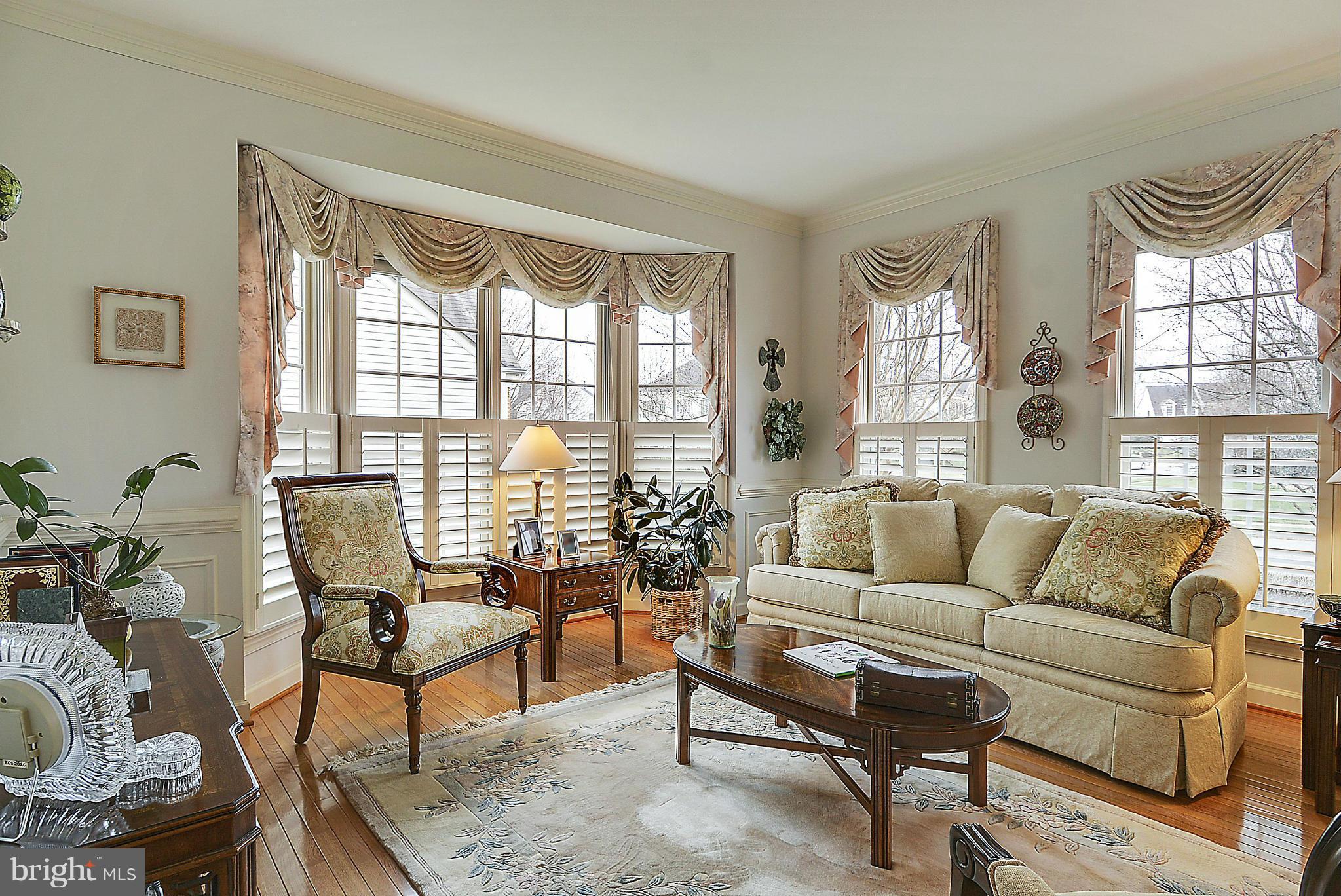 7406 Spring Summit Road Springfield, VA 22150 - Photo 6 of 30 a living room with furniture and a large window