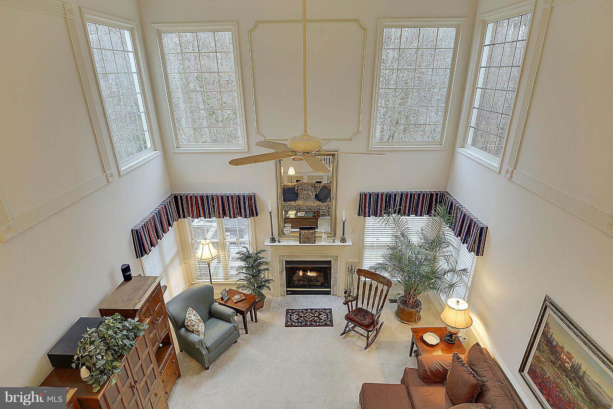 7406 Spring Summit Road Springfield, VA 22150 - Photo 9 of 30 a living room with furniture and a fireplace