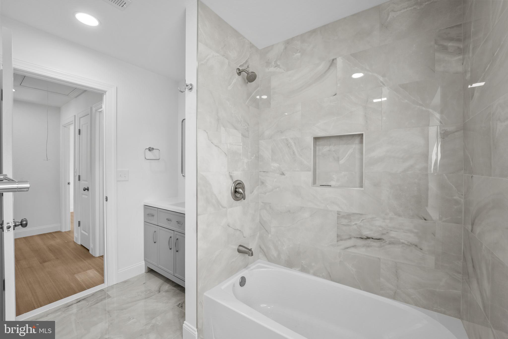 492 Ellis Avenue Lawnside, NJ 08045 - Photo 23 of 33 a bathroom with a bathtub and a shower