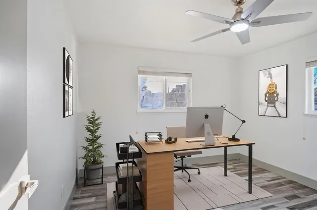 a view of a workspace with furniture