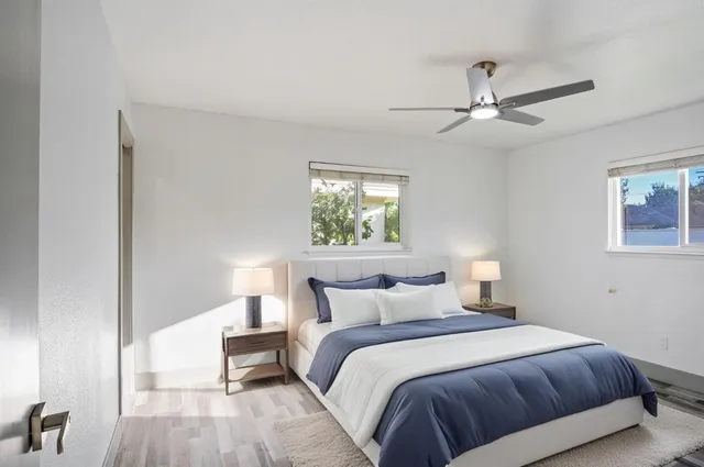 a bedroom with a bed and a window