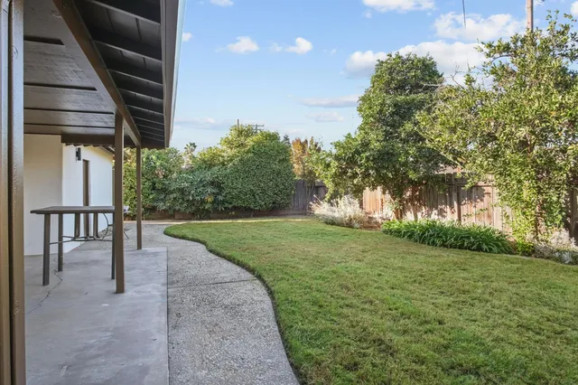 a view of backyard with green space