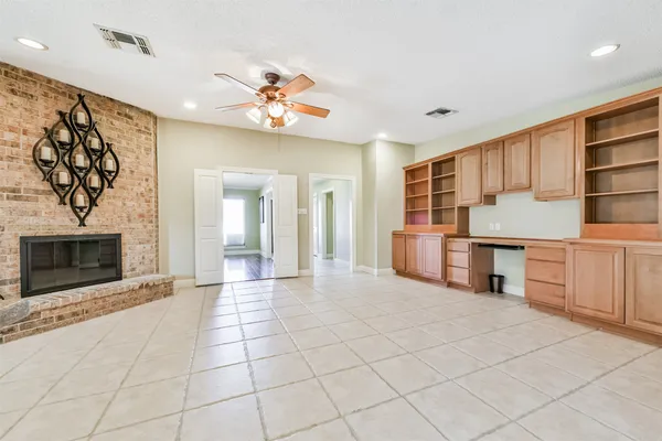 a view of a kitchen with furniture and a fireplace
