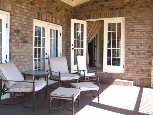 3320 La Costa Way Raleigh, NC 27610 - Photo 6 of 10 a view of a patio with couple of chairs and a potted plant