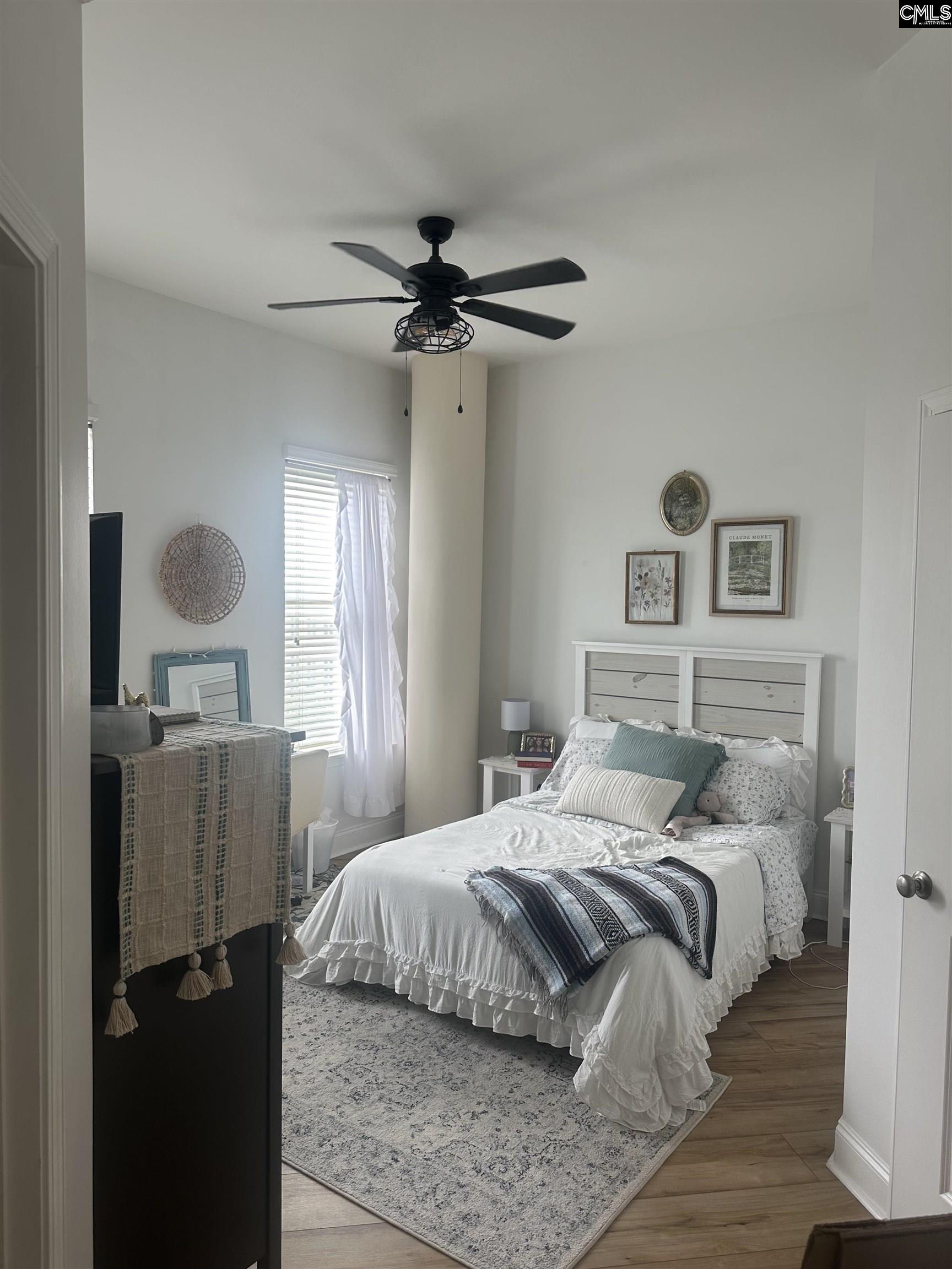 601 Main Street, Unit 323 Columbia, SC 29201 - Photo 29 of 68 a bedroom with a bed and window