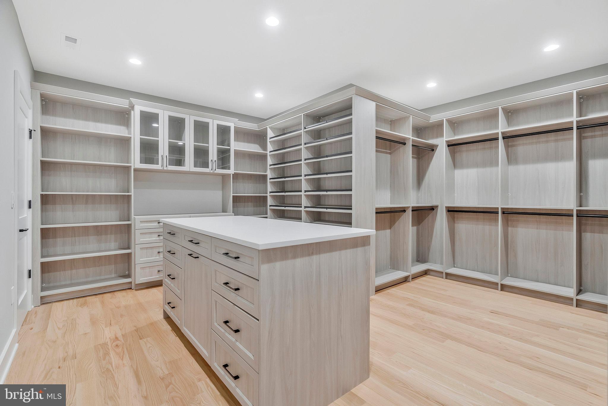 1907 Foxhall Road McLean, VA 22101 - Photo 48 of 100 An island with a semi-flush ceiling light at hers