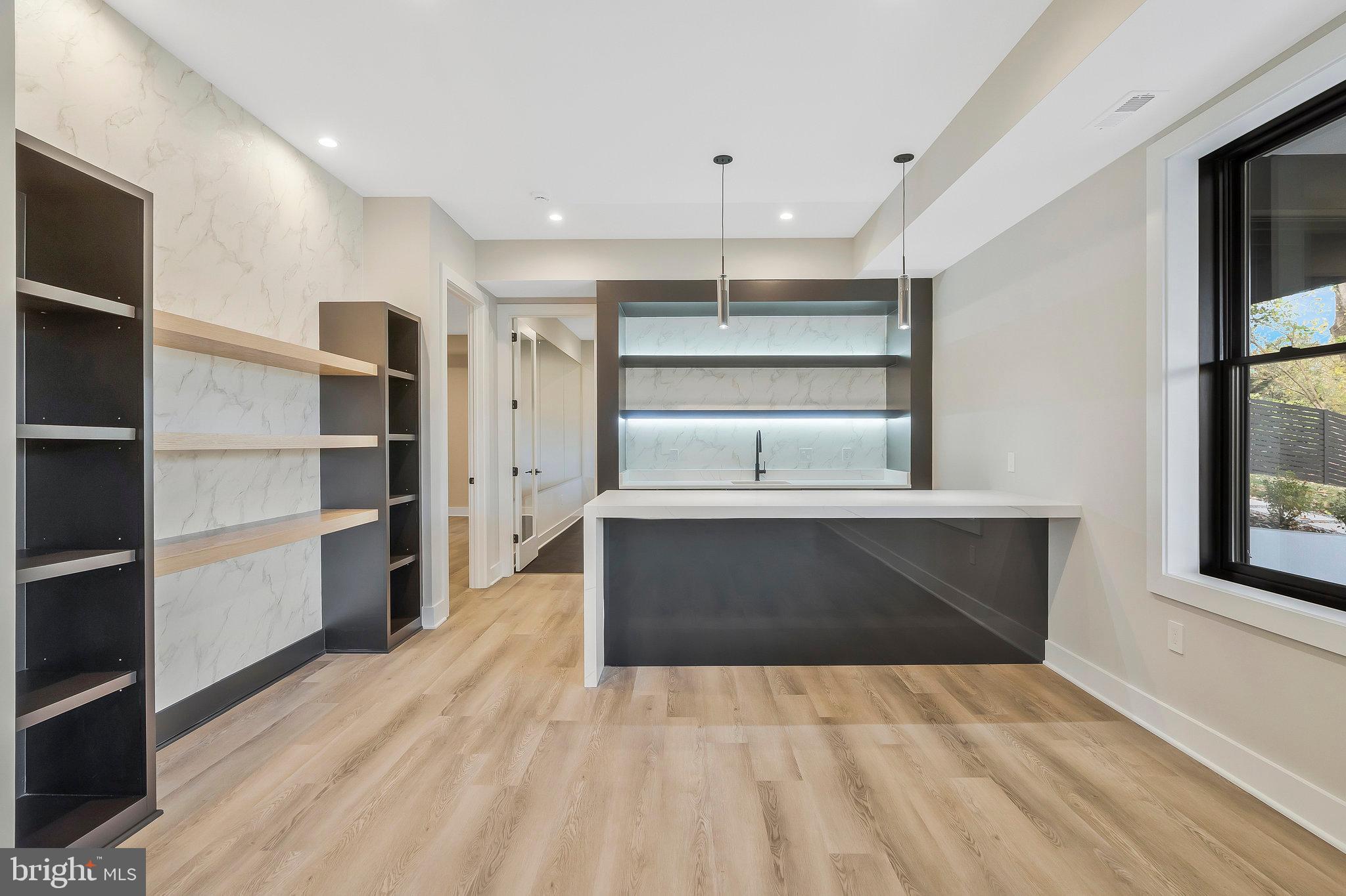 1907 Foxhall Road McLean, VA 22101 - Photo 78 of 100 Basement wet bar with an island and a dishwasher