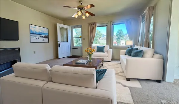 a kitchen with a refrigerator a stove top oven and cabinets
