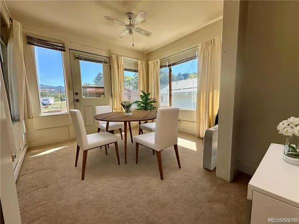 an empty room with windows and closet