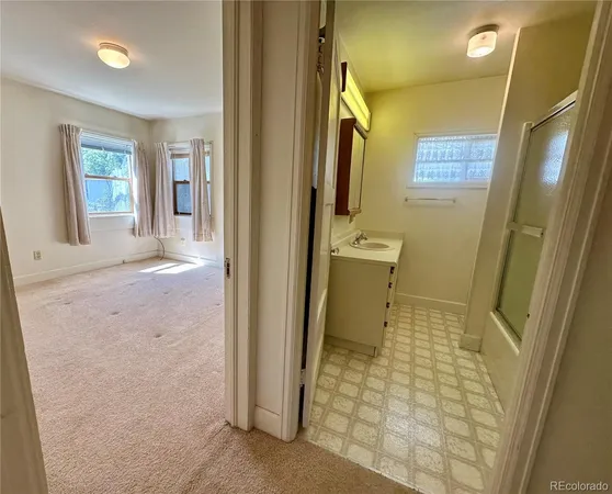 a bedroom with a bed and a potted plant