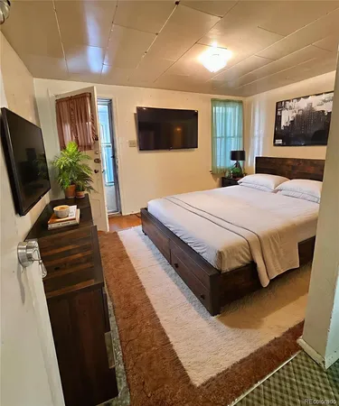 a bed room with a bed and furniture