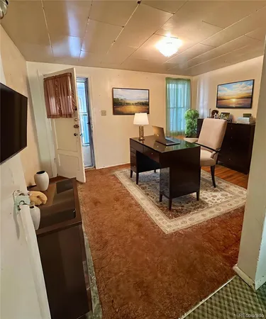 a kitchen with white cabinets and sink