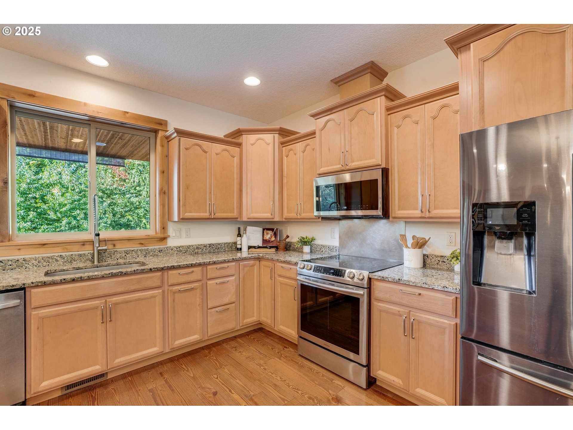 30076 Southeast Cemetery Road Estacada, OR 97023 - Photo 11 of 38 a kitchen with stainless steel appliances a sink cabinets and a window