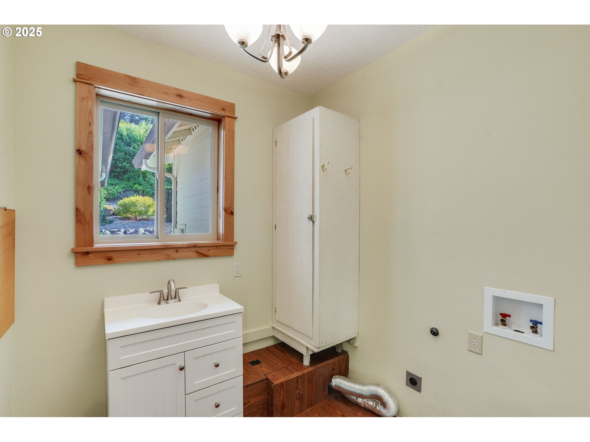 30076 Southeast Cemetery Road Estacada, OR 97023 - Photo 12 of 38 a bathroom with a sink a mirror and a window