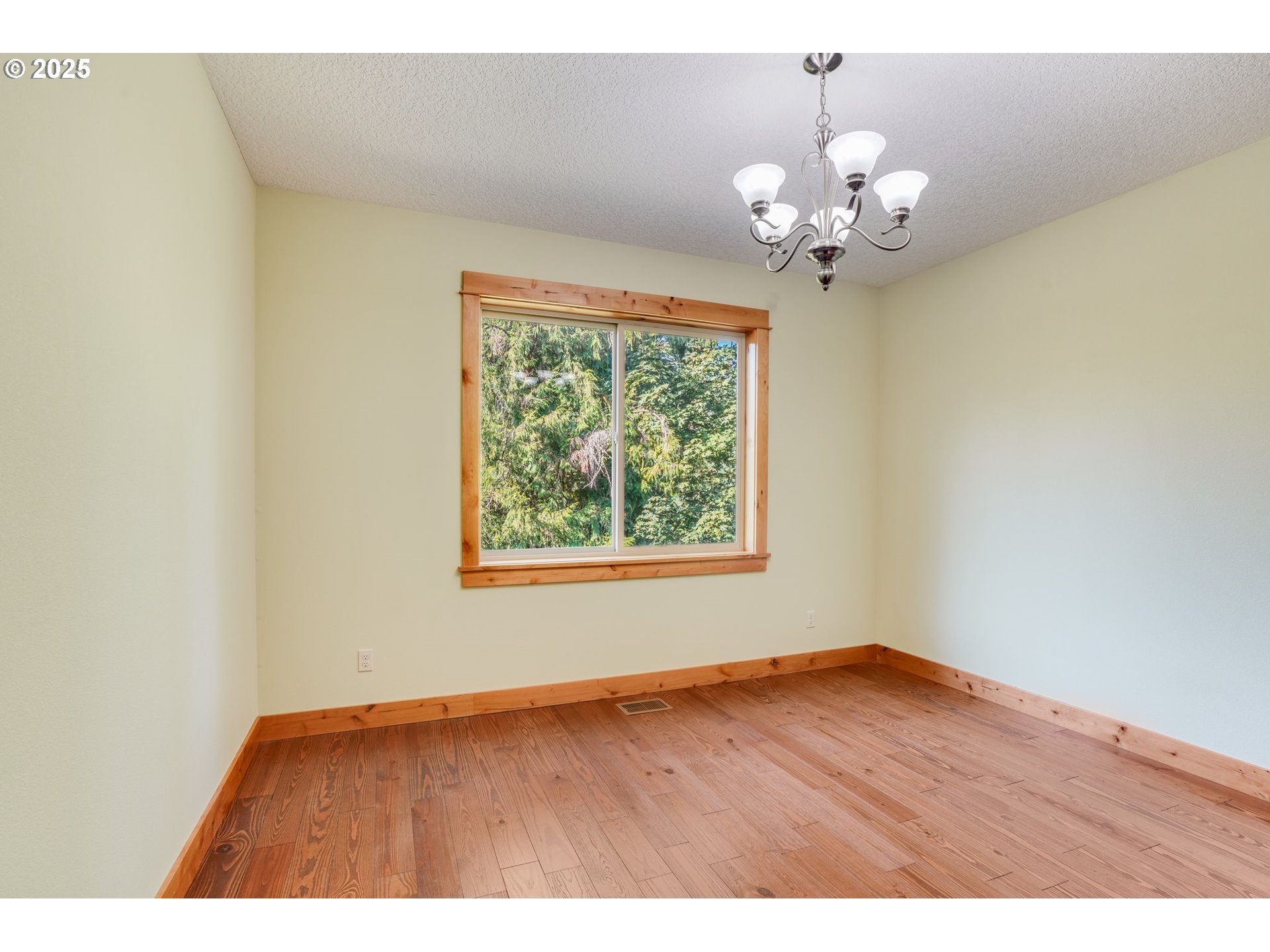 30076 Southeast Cemetery Road Estacada, OR 97023 - Photo 17 of 38 a view of an empty room with wooden floor and a window