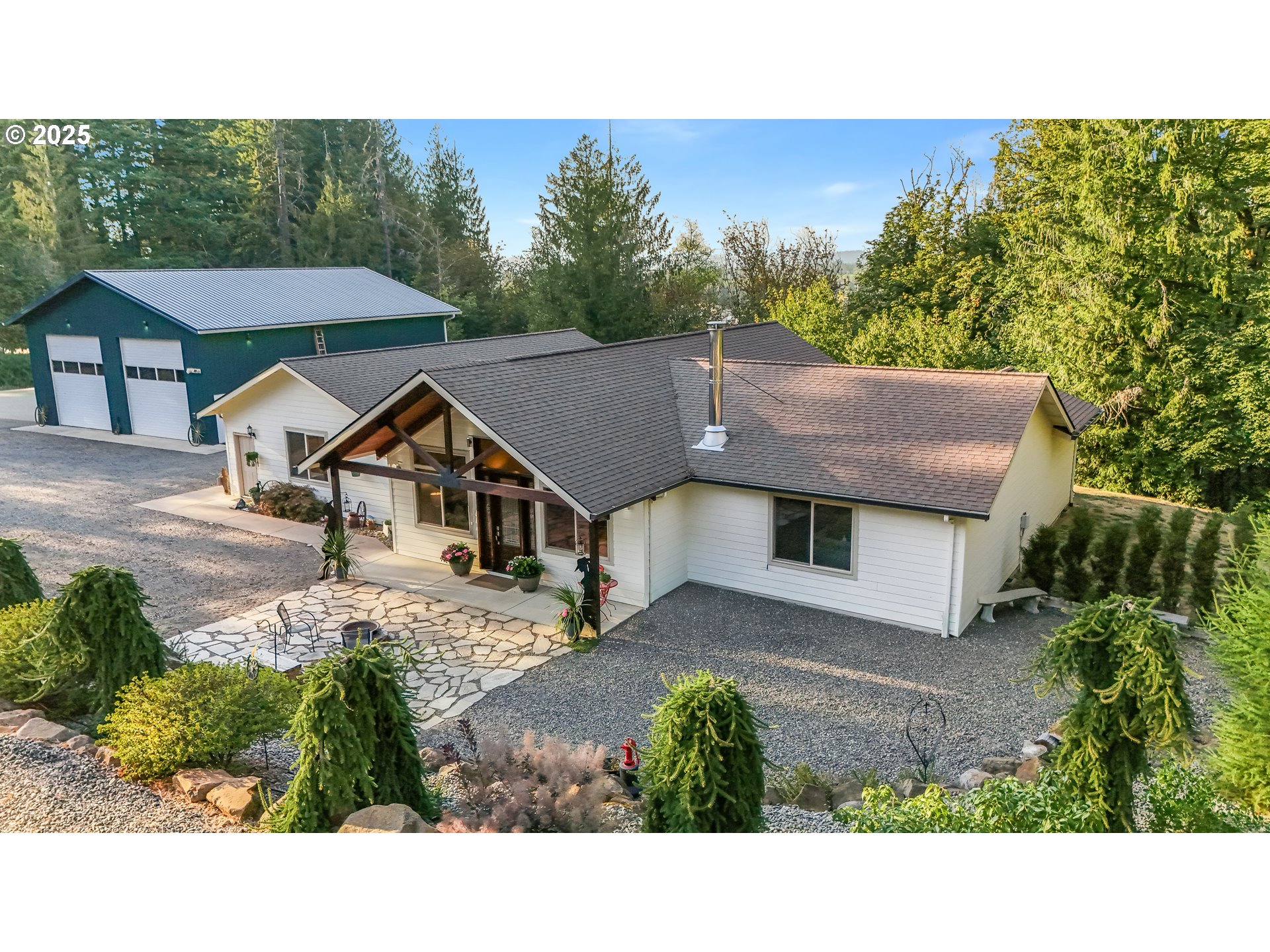 30076 Southeast Cemetery Road Estacada, OR 97023 - Photo 2 of 38 a house view with a garden space