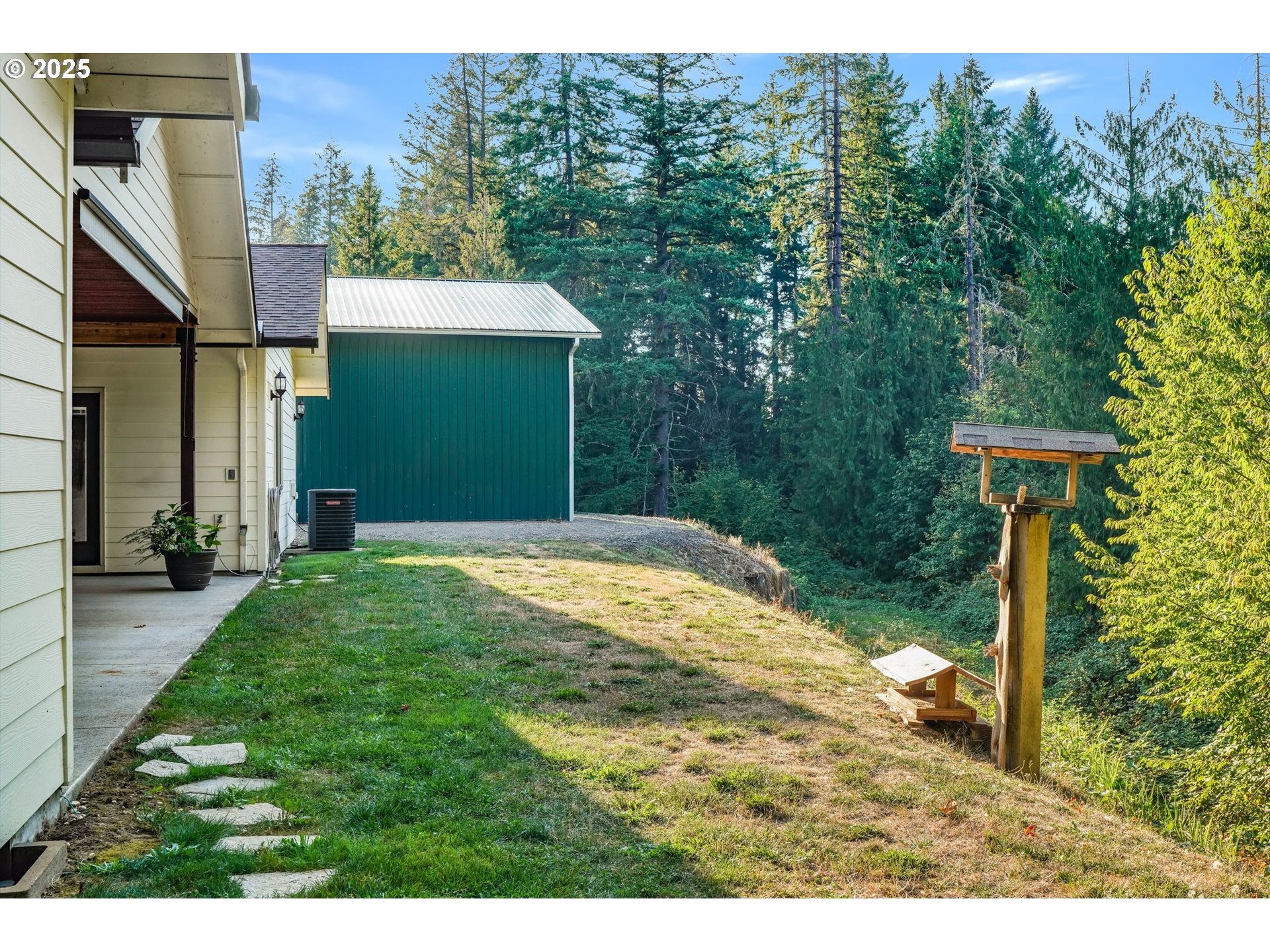 30076 Southeast Cemetery Road Estacada, OR 97023 - Photo 28 of 38 a backyard of a house with lots of green space