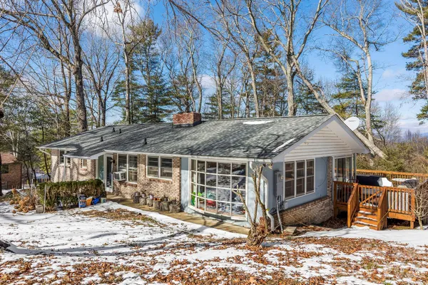 a view of a house with snow on the roof