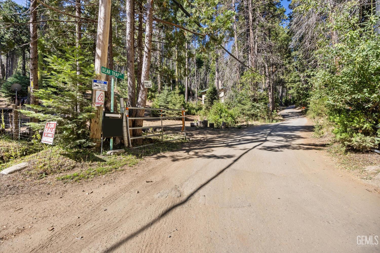 Undisclosed Address Posey, CA 93260 - Photo 27 of 28 a backyard of a house with lots of green space