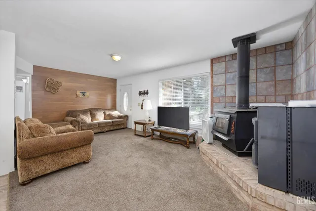 a living room with furniture window and a flat screen tv