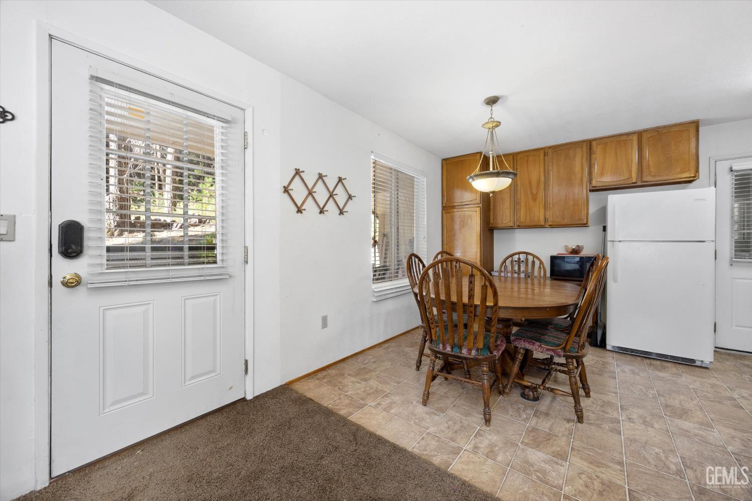 Undisclosed Address Posey, CA 93260 - Photo 8 of 28 a view of a dining room with furniture and a chandelier